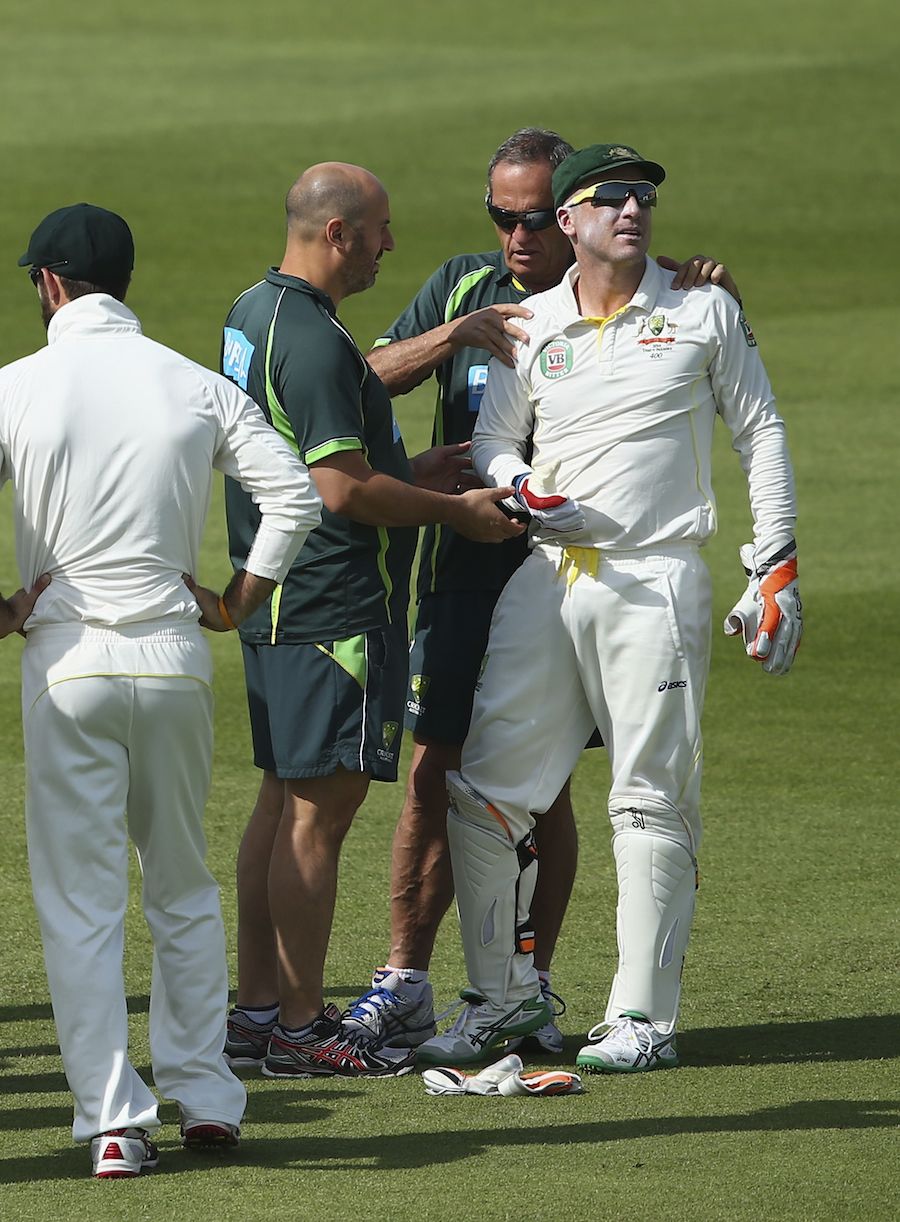 Brad Haddin gets his shoulder checked by Alex Kountouris and Peter Brukner