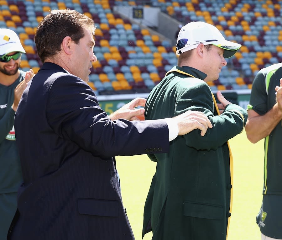 Mark Taylor puts the captain's blazer on Steven Smith