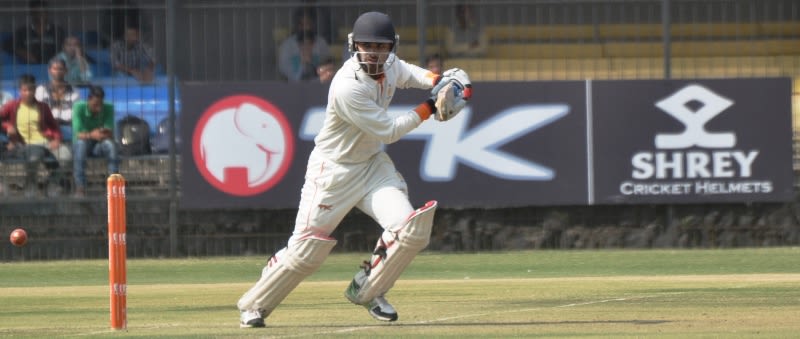 Aditya Shrivastava guides the ball during his century