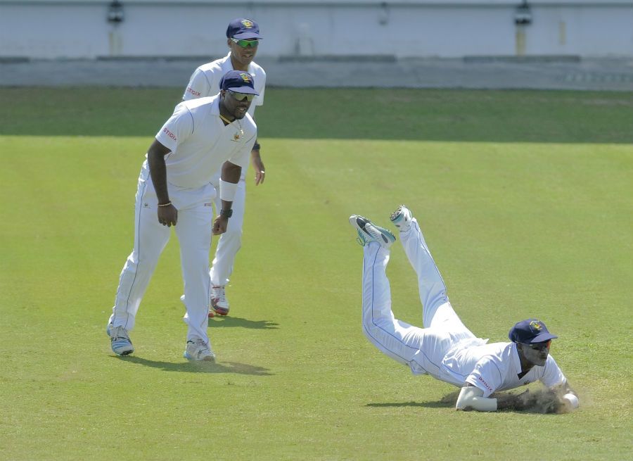 Ashley Nurse and Kraigg Brathwaite watch Kyle Corbin take a catch