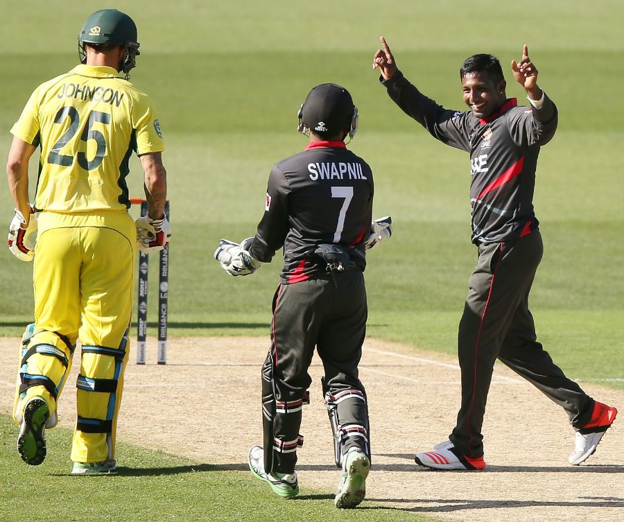 Krishna Chandran celebrates taking a wicket