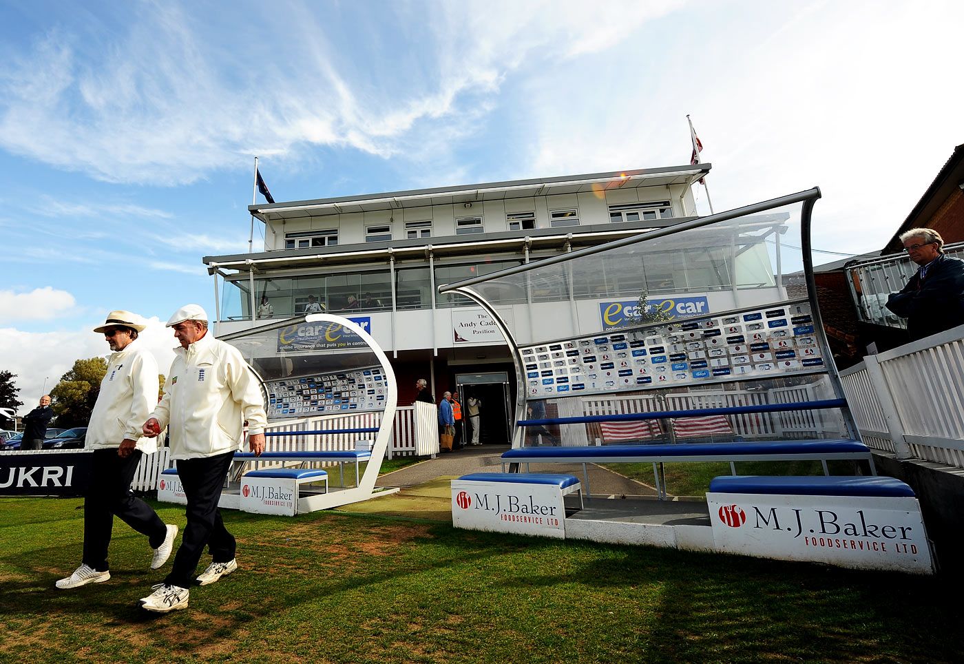 Peter Willey and George Sharp walk into the field