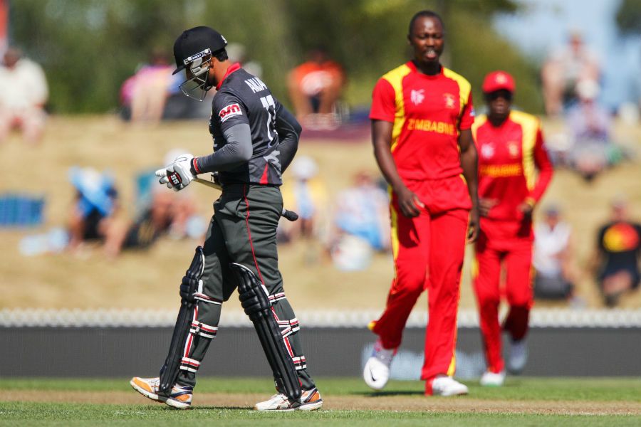 Tendai Chatara looks on as Amjad Ali walks off the field