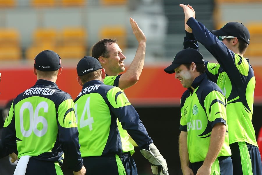 Alex Cusack is congratulated on the wicket of Rohan Mustafa
