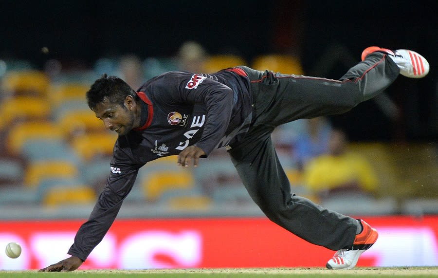 Krishna Chandran dives to stop the ball