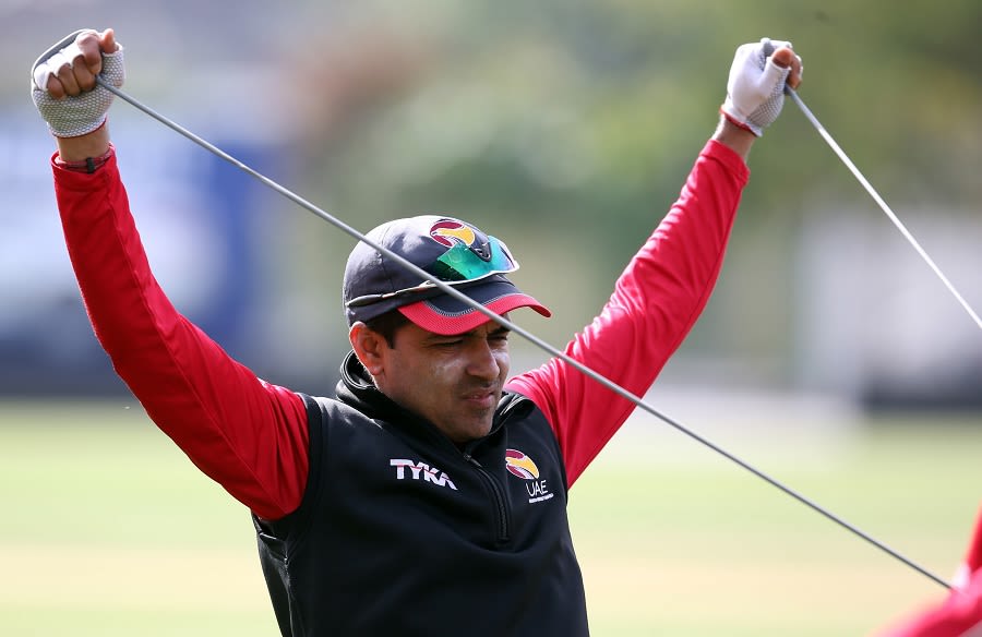 Khurram Khan stretches during a practice session