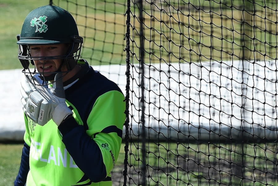 Alex Cusack adjusts his gear in the nets
