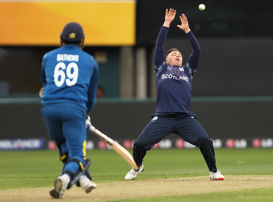 Matt Machan drops Angelo Mathews off his own bowling