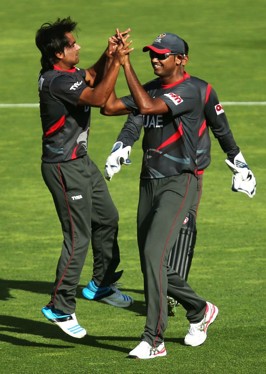 Kamran Shazad is congratulated after he dismissed AB de Villiers 