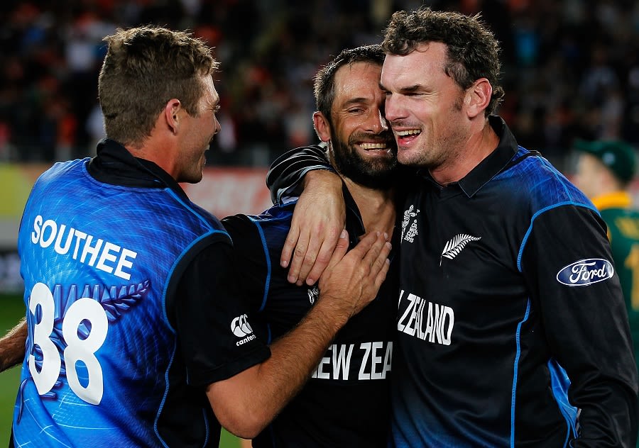 Grant Elliott, Kyle Mills and Tim Southee soak in the historic win