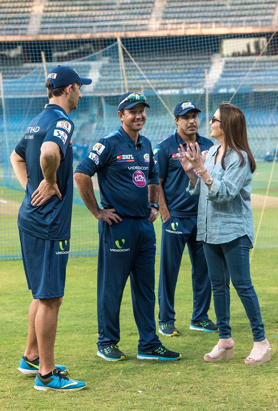 Mumbai Indians owner Nita Ambani talks to members of the team's coaching staff