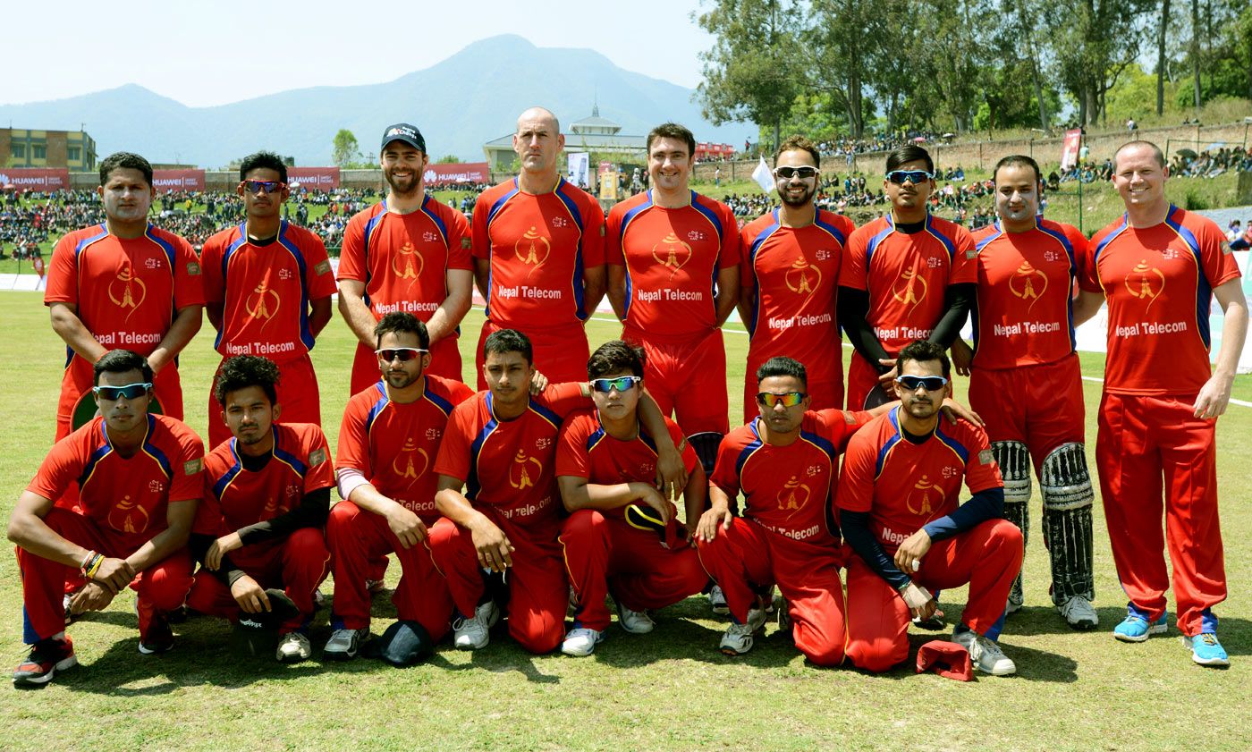 Cricketers from Nepal and Australia line up ahead of a match held as a tribute to Phillip Hughes in Kathmandu