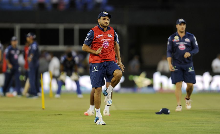 Pawan Suyal warms-up before the match