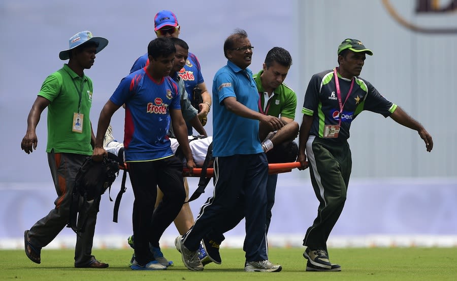 Shahadat Hossain is stretchered off the field