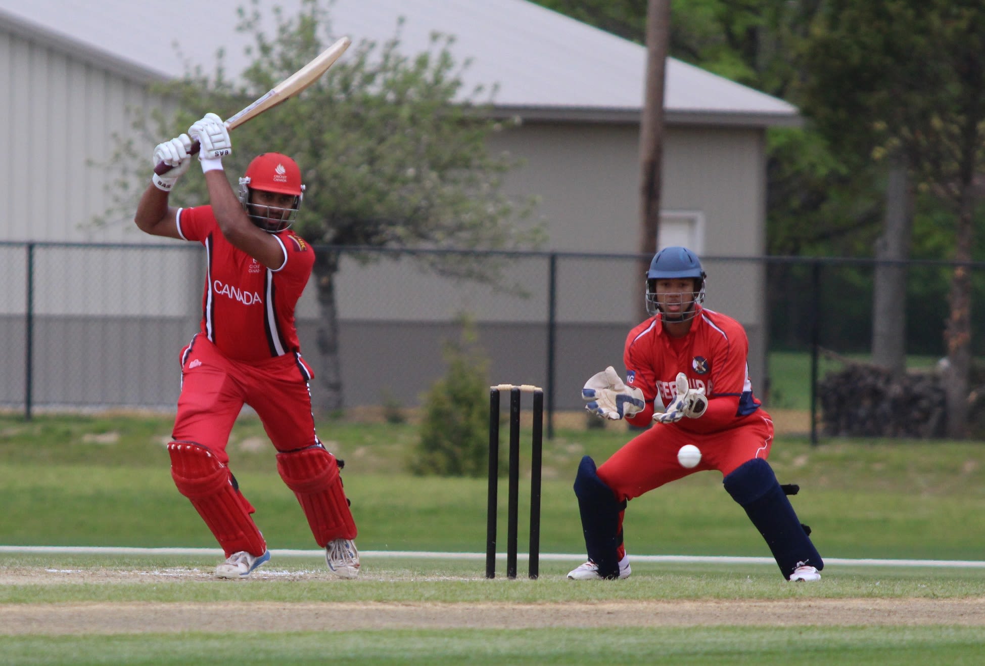 Ruvindu Gunasekera drives through the off side
