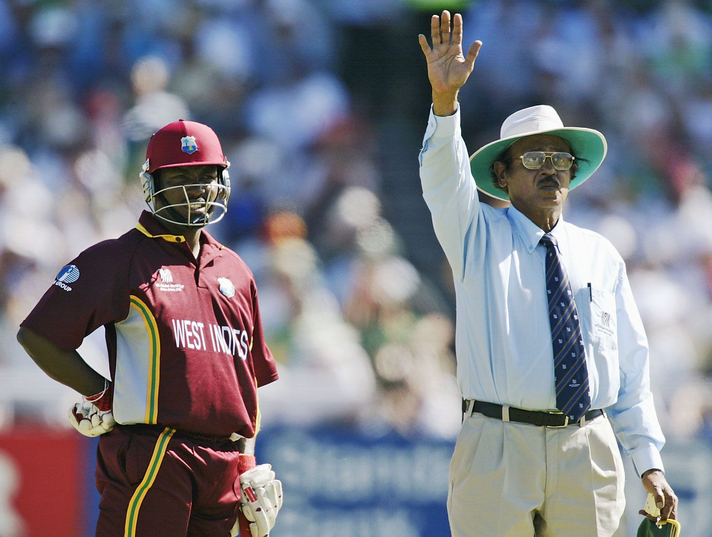Umpire S Venkataraghavan signals a bye as Brian Lara looks on