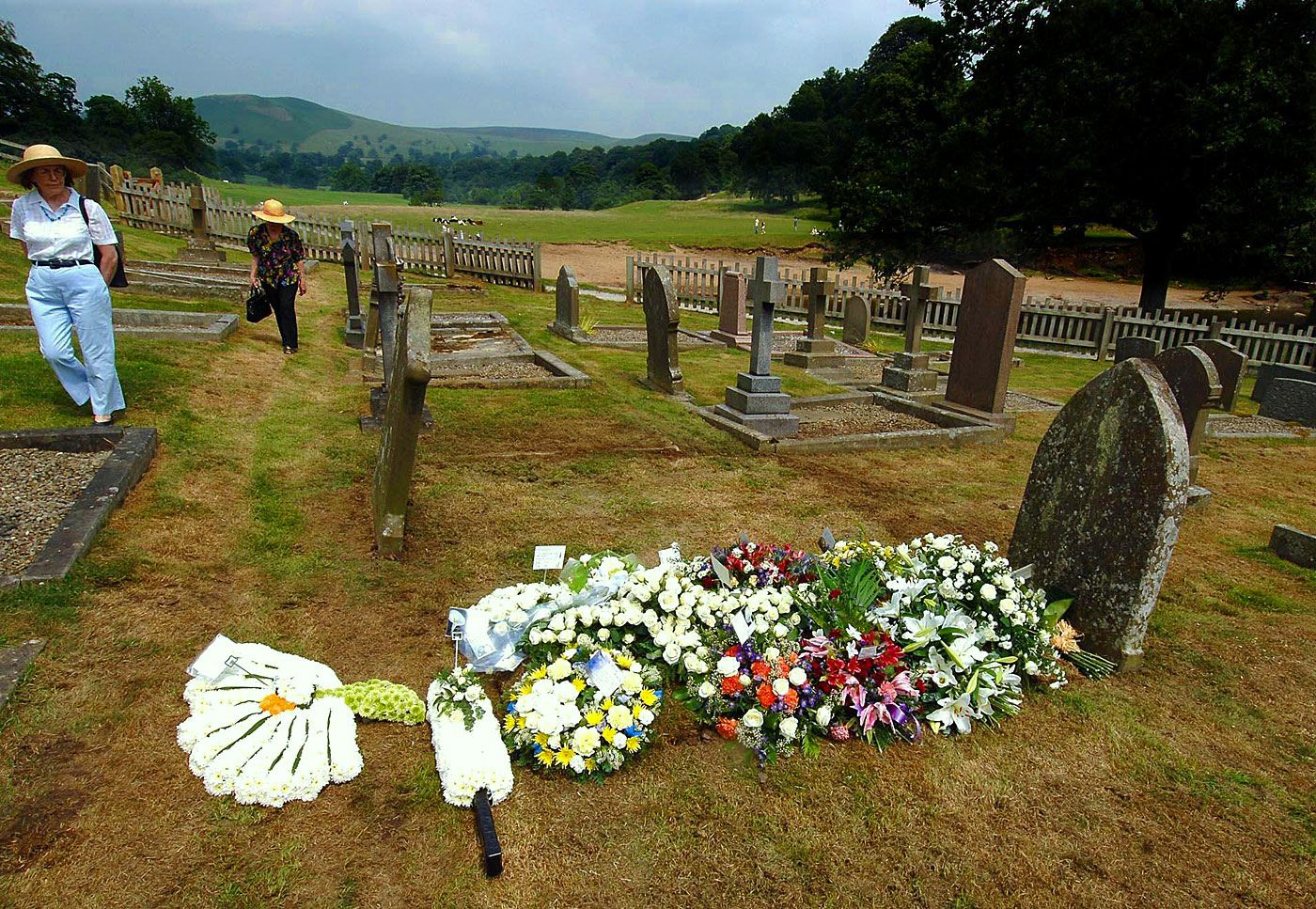 Flowers are placed on the grave of Fred Trueman at Bolton Abbey