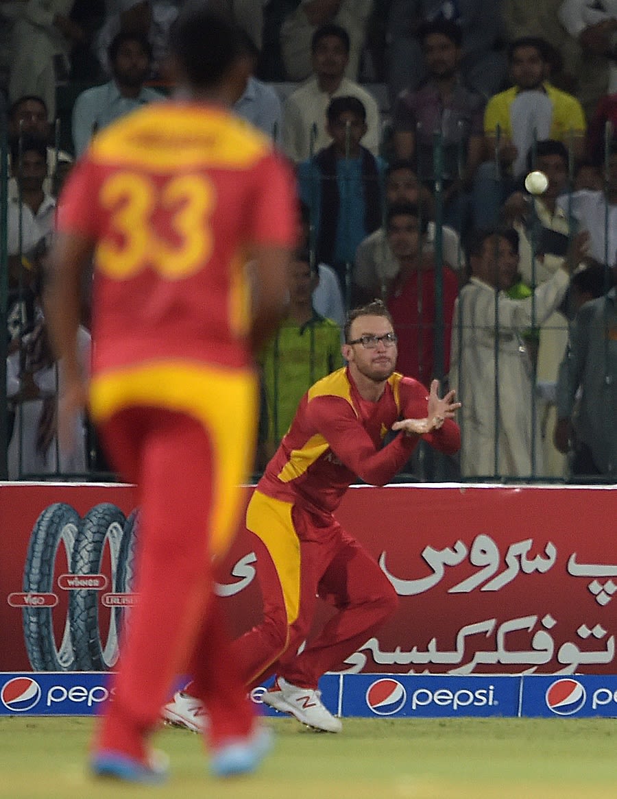 Charles Coventry shapes to hold on to Mohammad Hafeez's catch