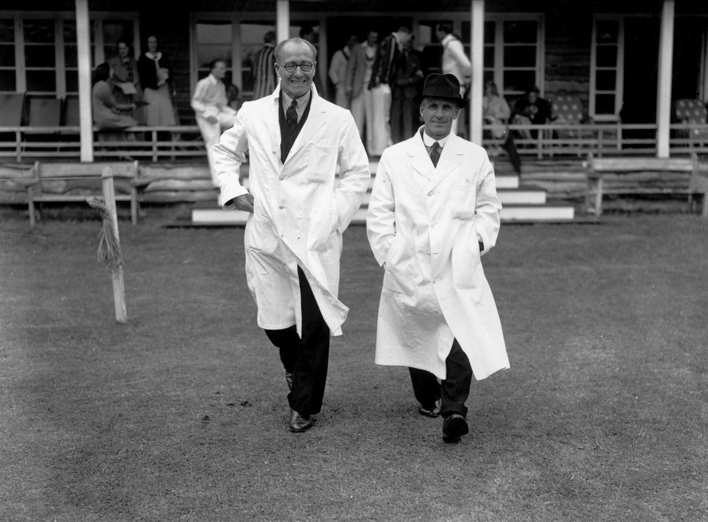 Umpires Andy Ducat and Bert Strudwick stride out for a charity match