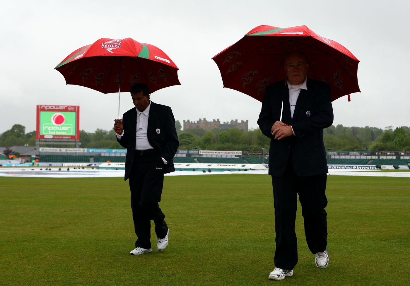 Umpires Asoka de Silva and Steve Davis walk off