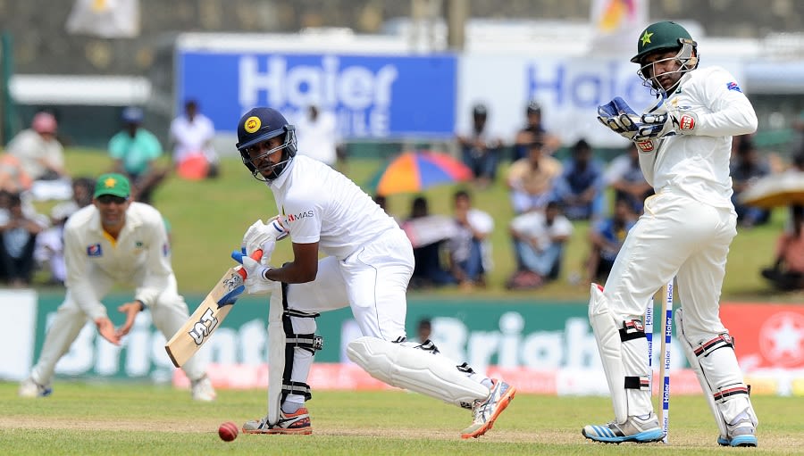 Kithuruwan Vithanage steers the ball through the off side