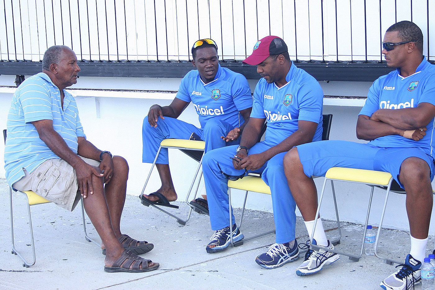 Andy Roberts has a chat with a few West Indies players during a training camp