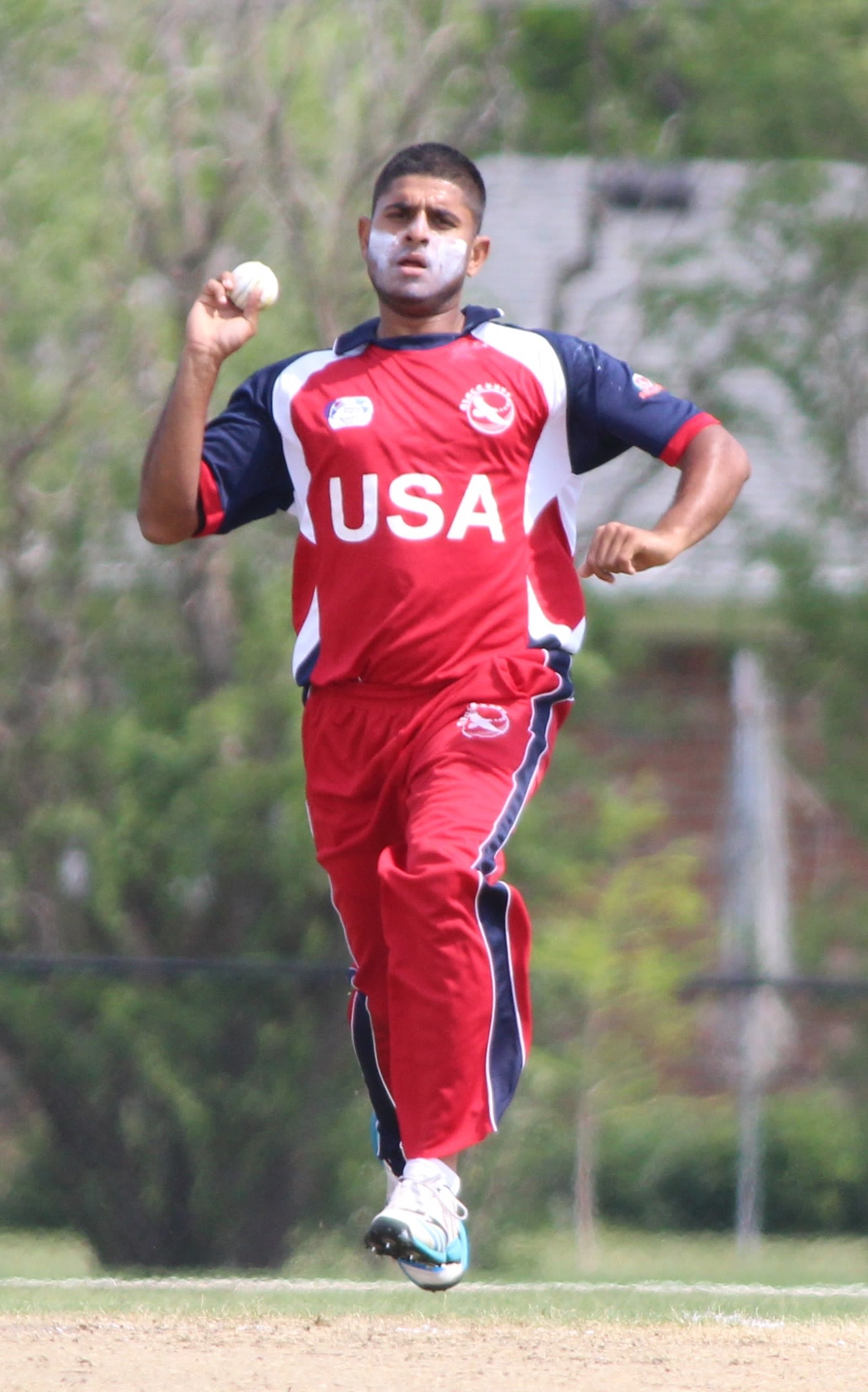 Adil Bhatti runs in to bowl at the death