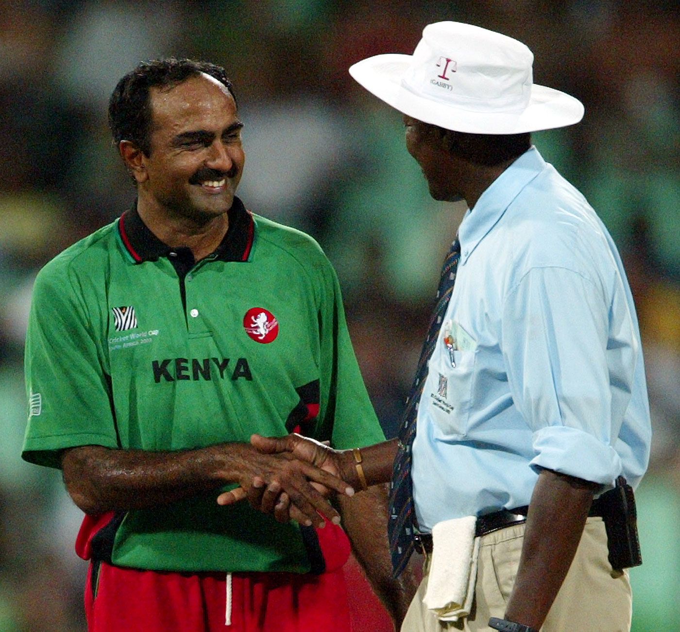 Aasif Karim is congratulated by Steve Bucknor after his spell