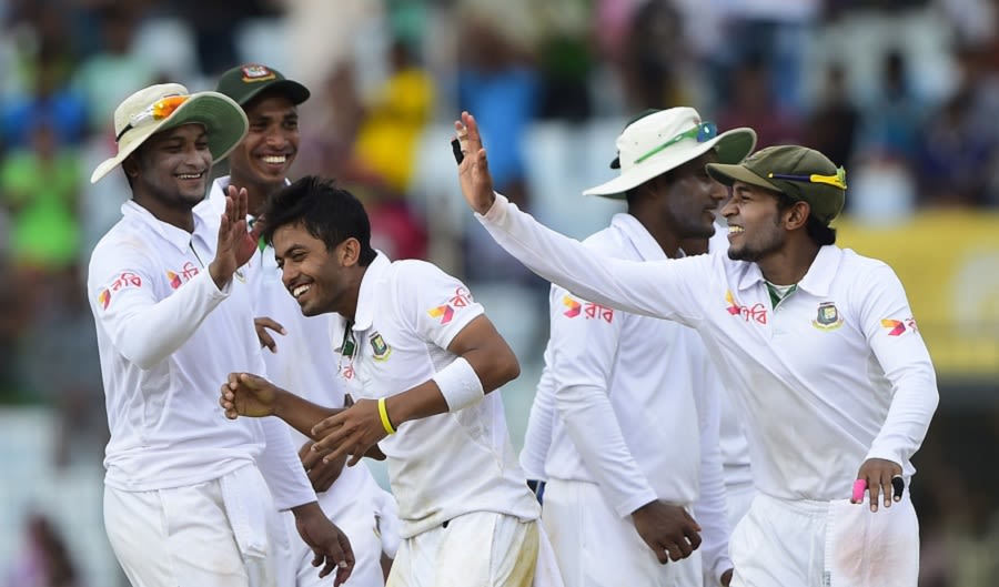 Jubair Hussain is congratulated by his team-mates after he dismissed Dale Steyn