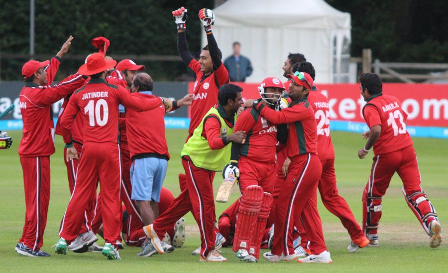 Zeeshan Siddiqui is mobbed by elated team-mates