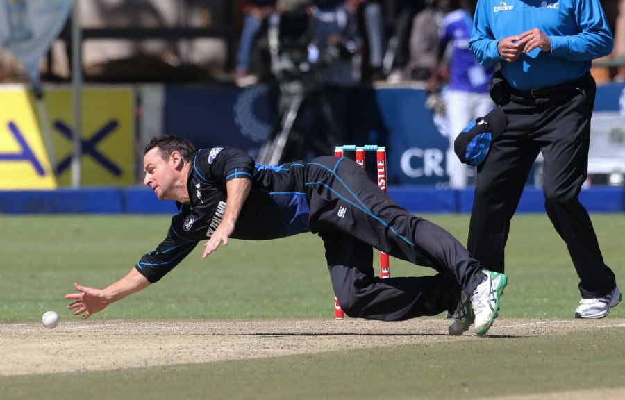 Nathan McCullum fields off his own bowling