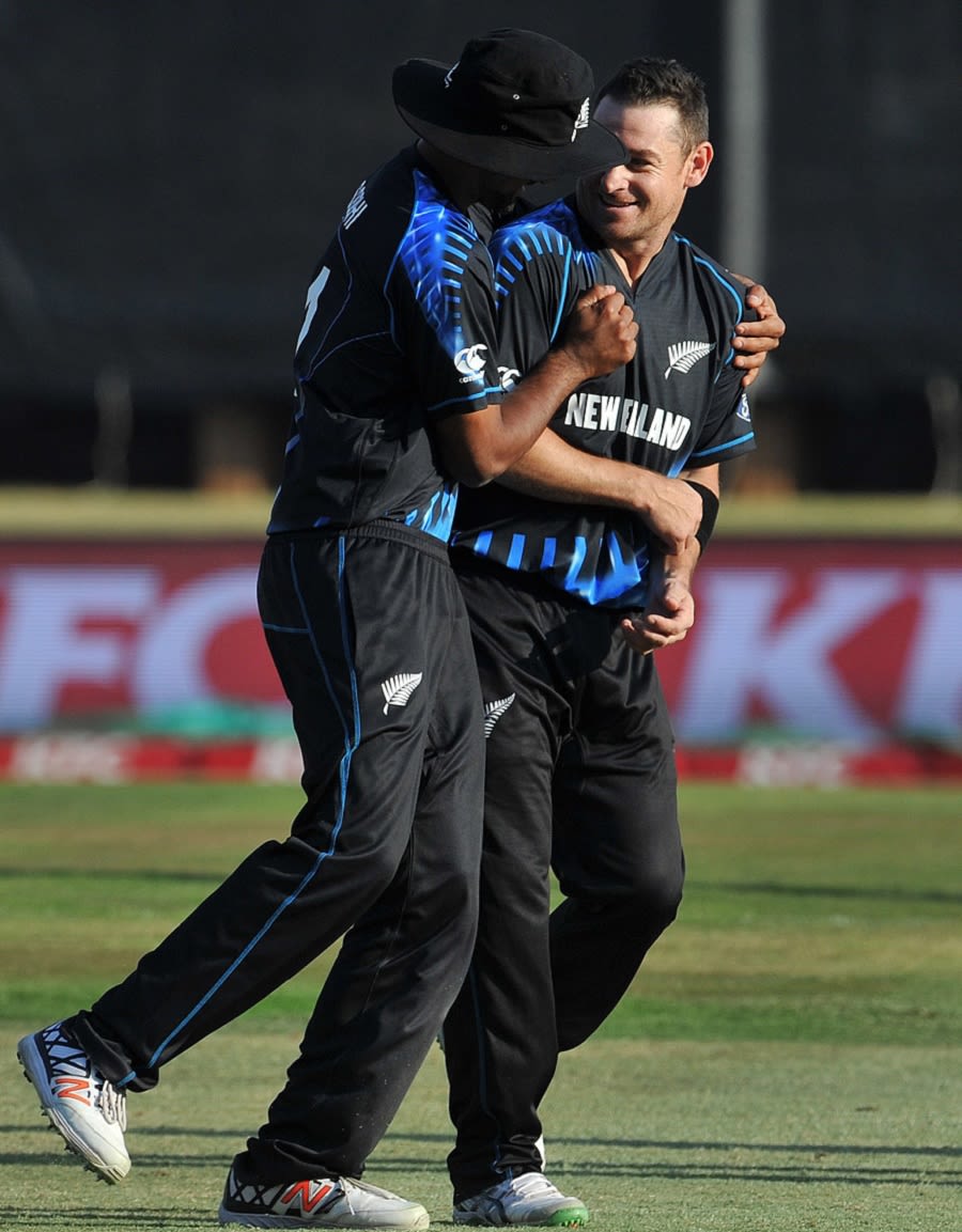 Nathan McCullum is congratulated by Ish Sodhi for dismissing AB de Villiers