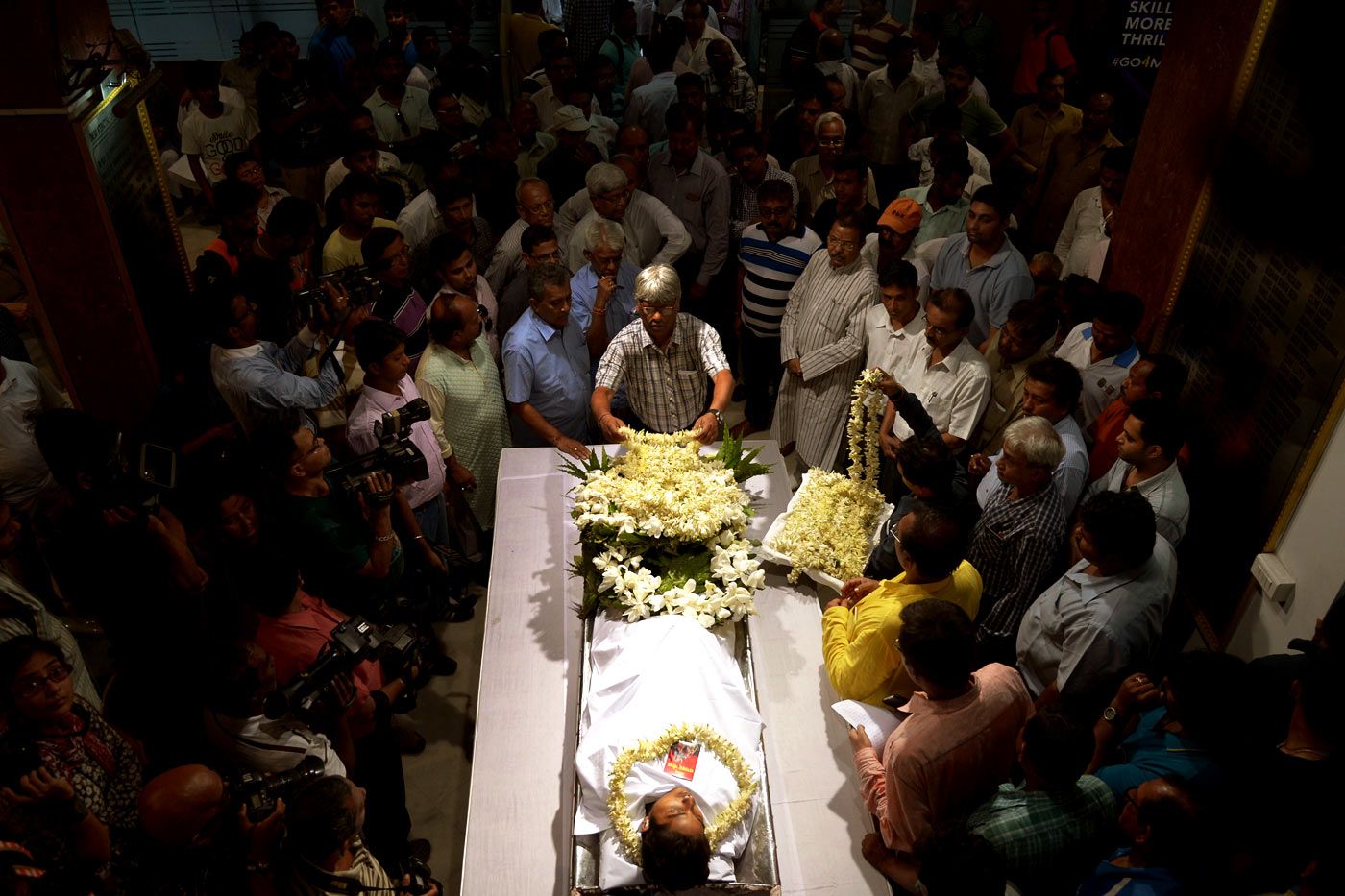 Mourners gather around the body of Ankit Keshri