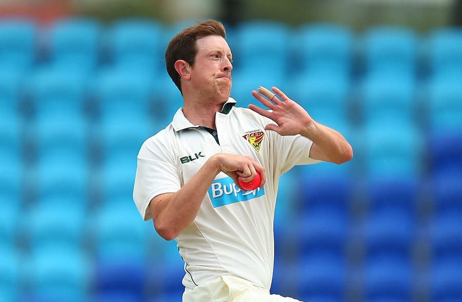 Andrew Fekete runs in to bowl