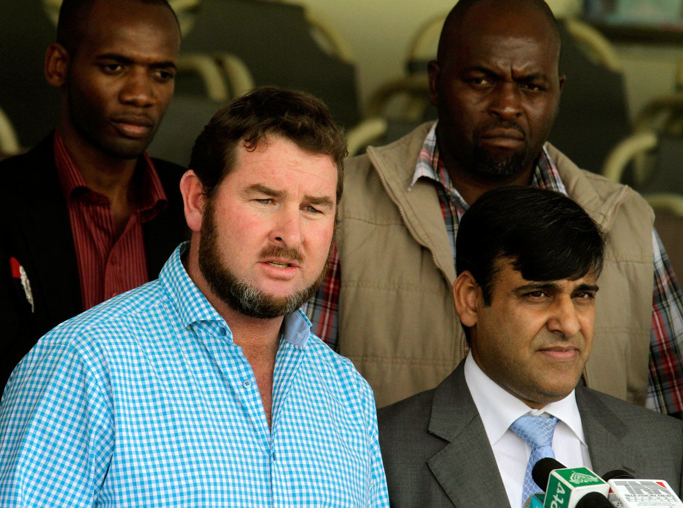 Alistair Campbell talks to reporters after reviewing the security arrangements at the Gaddafi Stadium