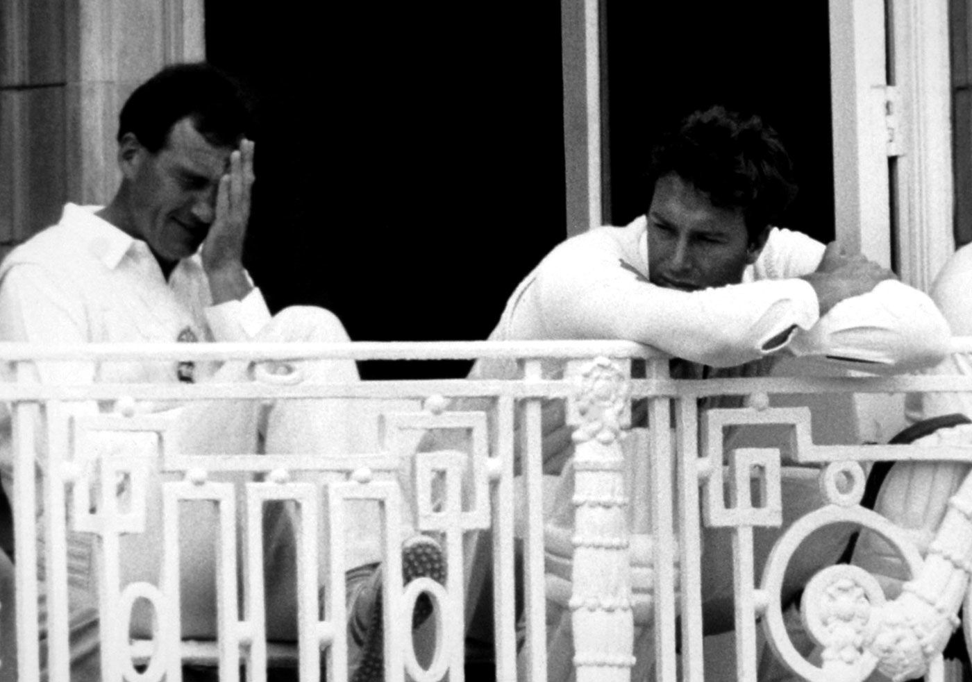 Captain John Emburey isn't happy with England's performance. Bowler Derek Pringle sits next to him