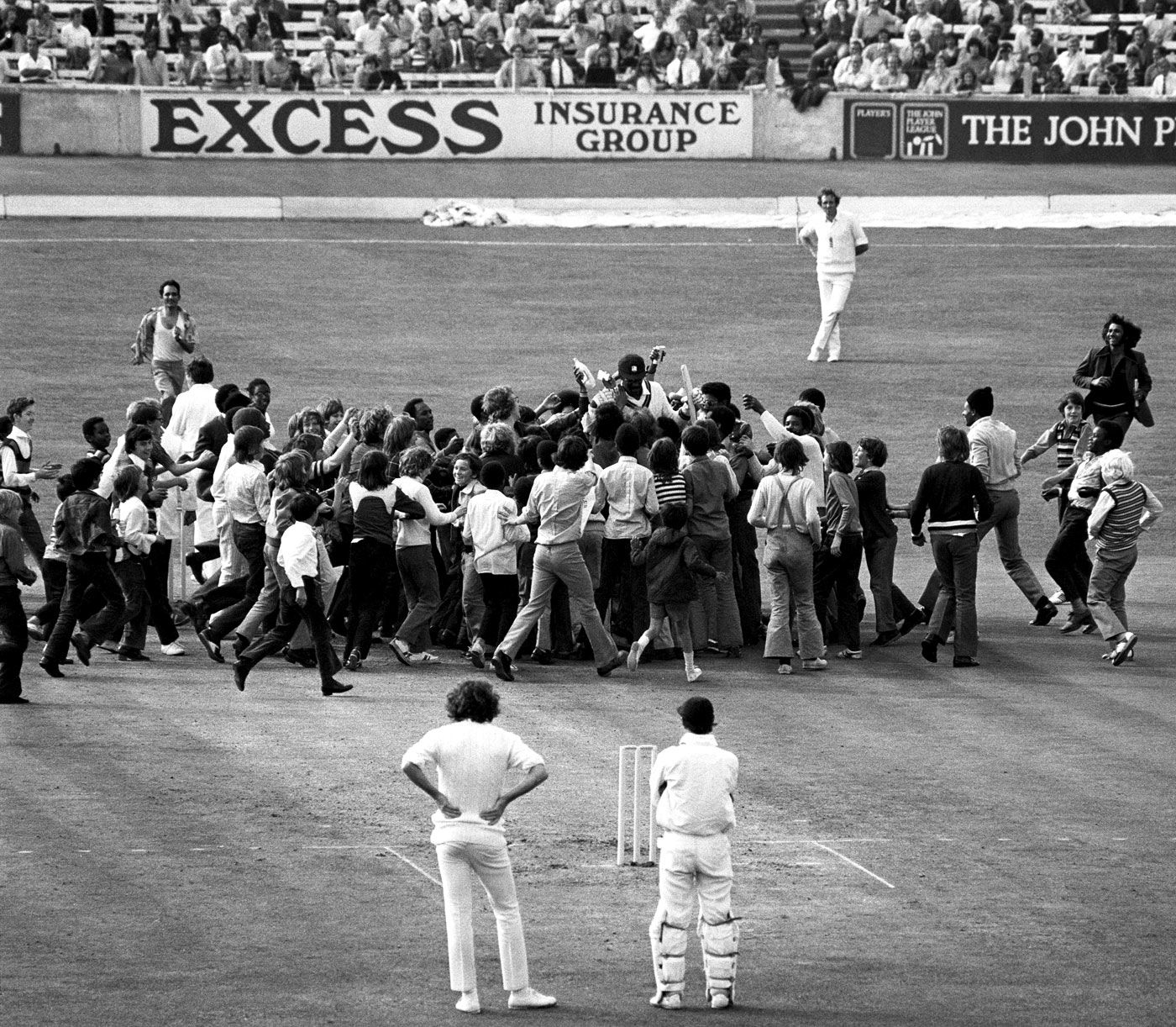 Spectators swarm Clive Lloyd to celebrate his century