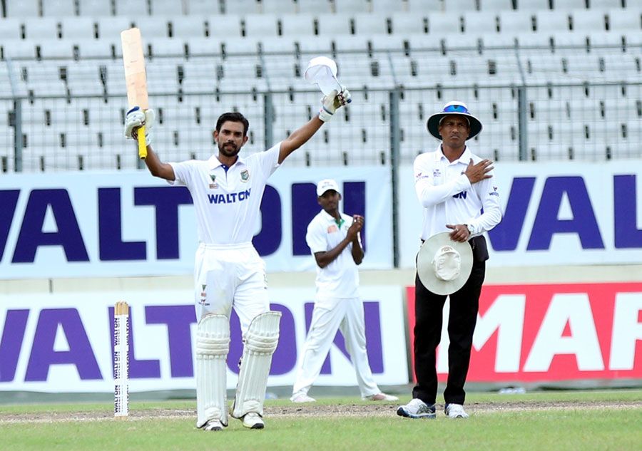 Marshall Ayub raises his bat after scoring a match-saving hundred