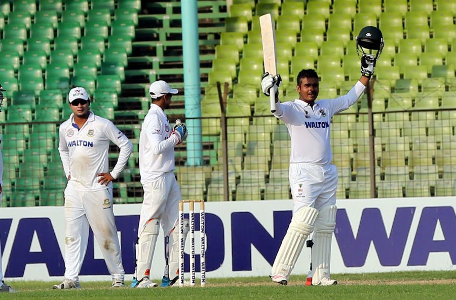 Shamsur Rahman raises his bat after making hundred