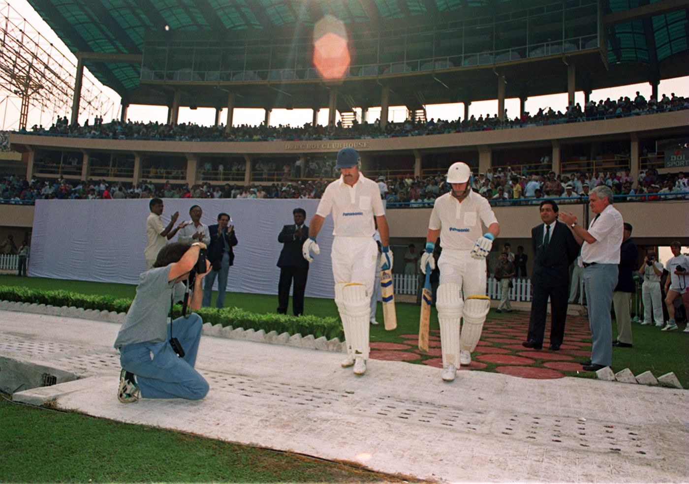 Jimmy Cook and Andrew Hudson walk out to open the innings