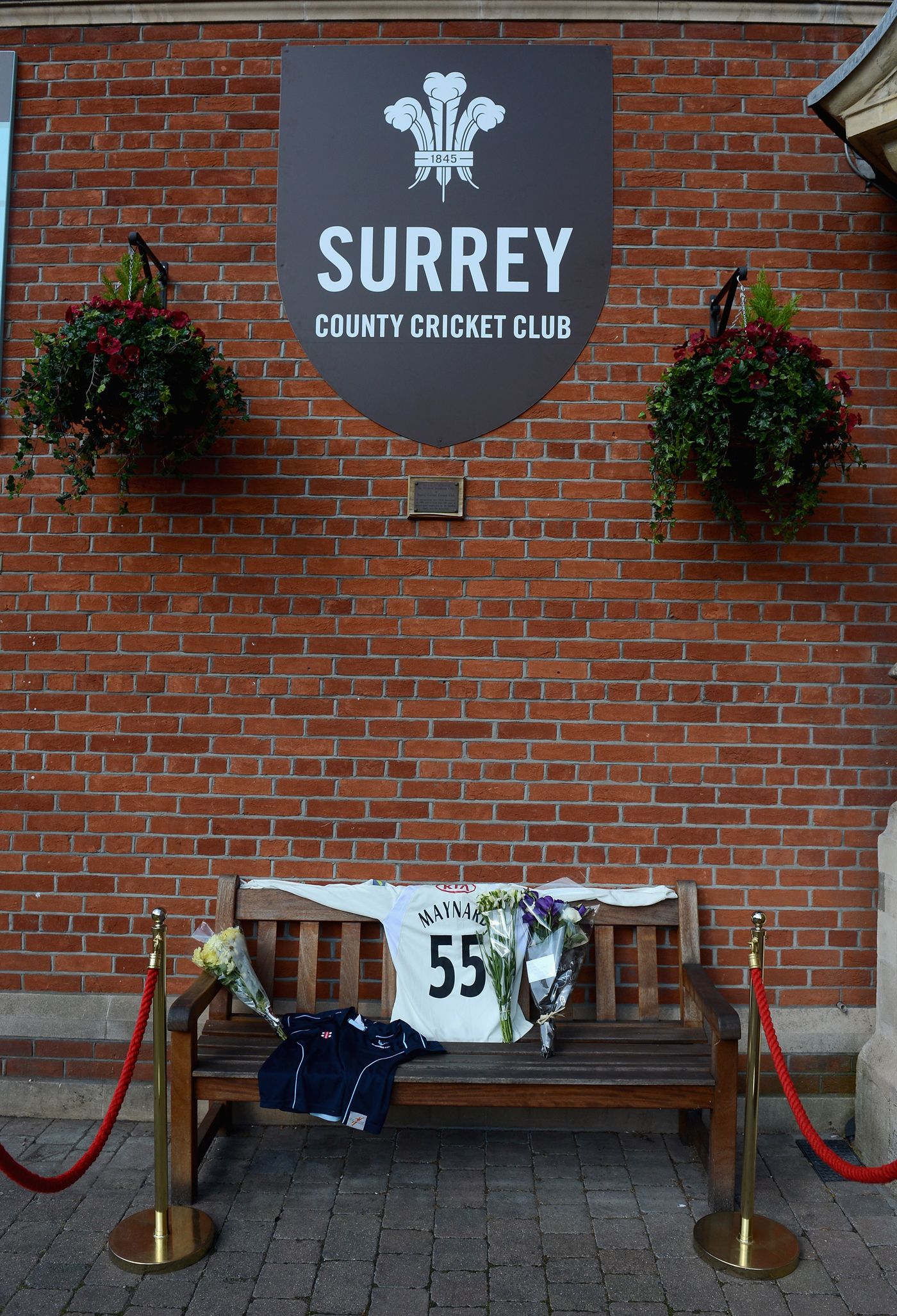 A bench displays tributes to Tom Maynard