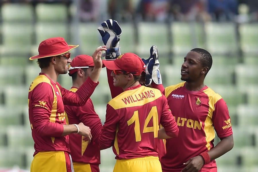 Tinashe Panyangara is mobbed by his team-mates