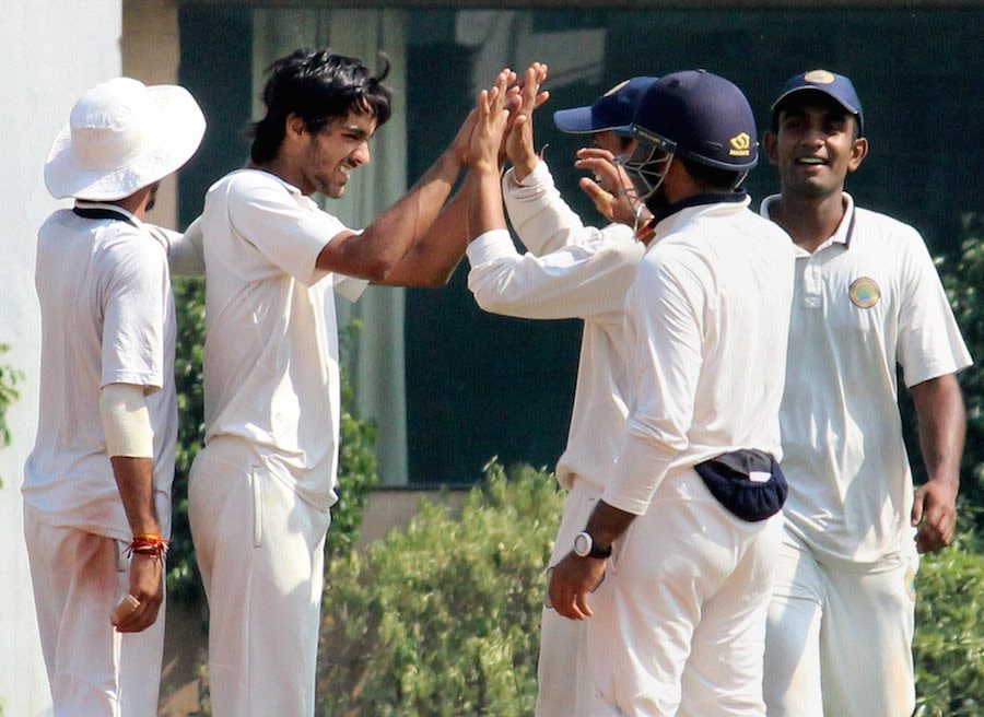 Chaitanya Bishnoi is congratulated after a wicket