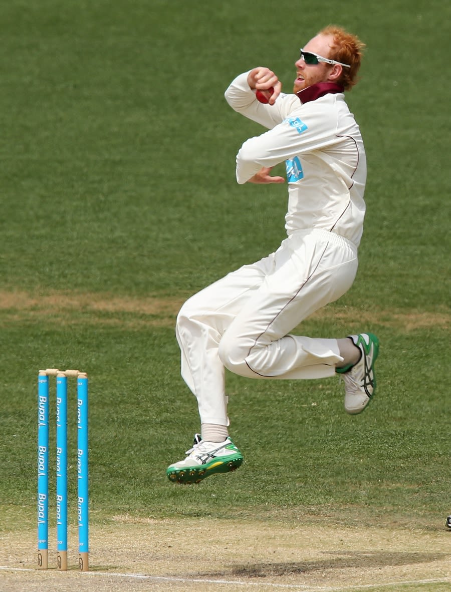 Jason Floros runs in to bowl