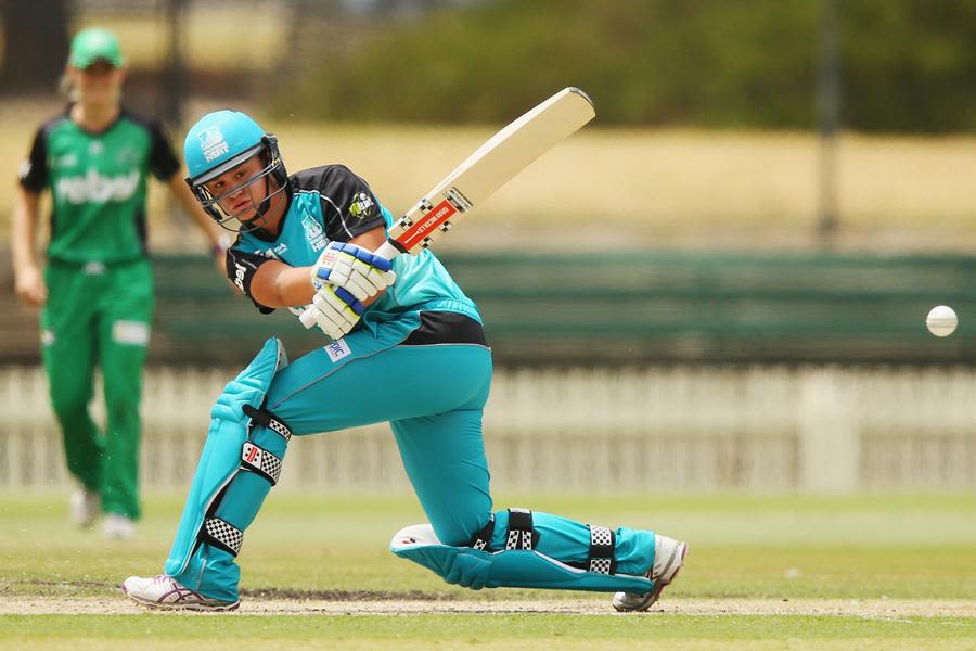 Ashleigh Barty sweeps during her first day of elite cricket