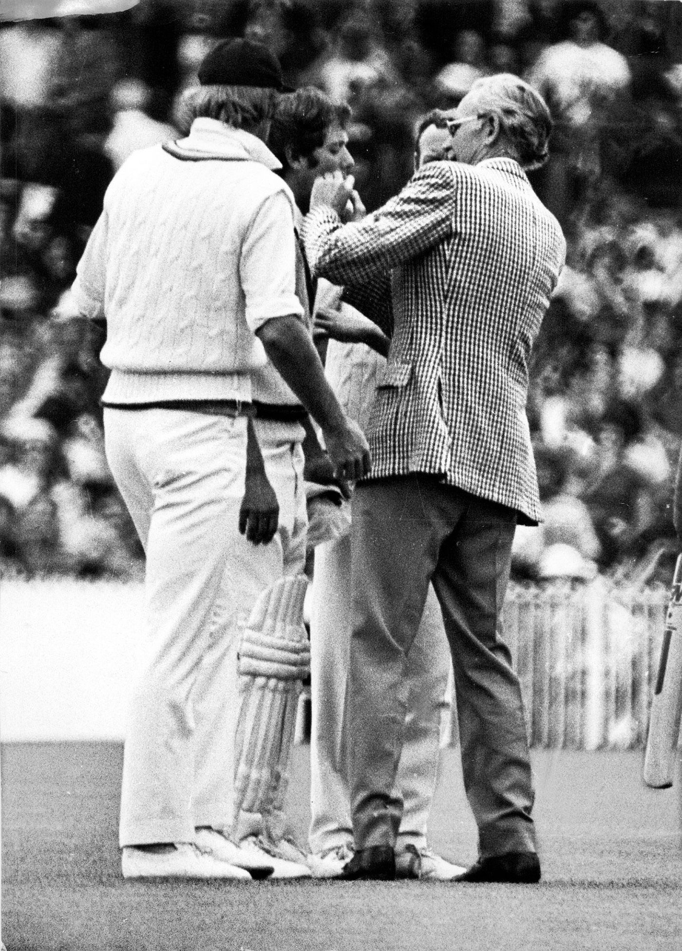 Rick McCosker is tended to by a doctor