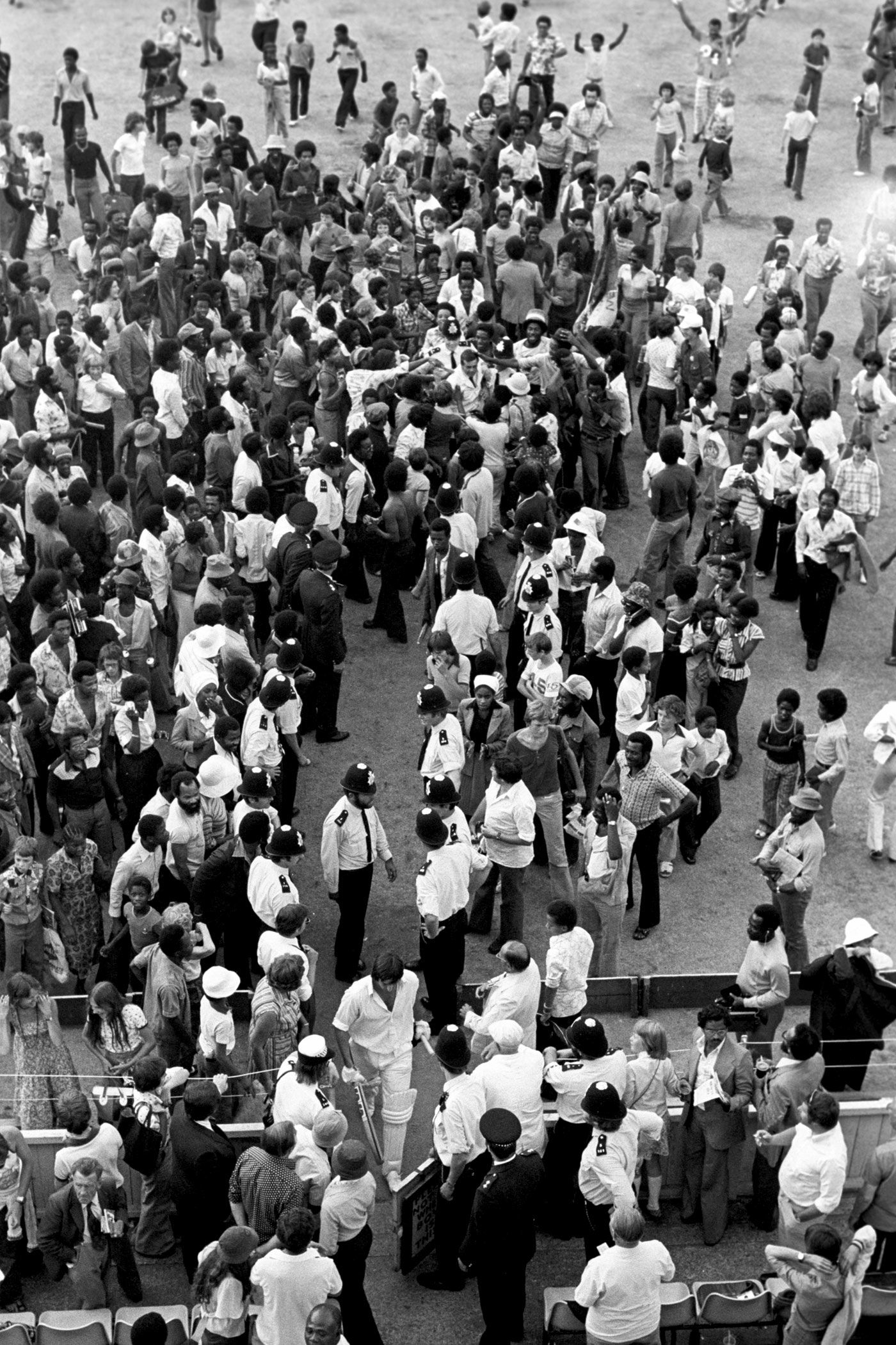 Batsman Mike Selvey and Dickie Bird walk back through the crowd