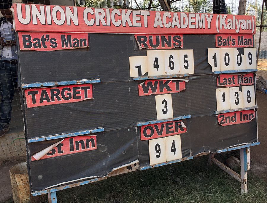 A scoreboard at the ground in Kalyan displays Pranav Dhanawade's record score of 1009*