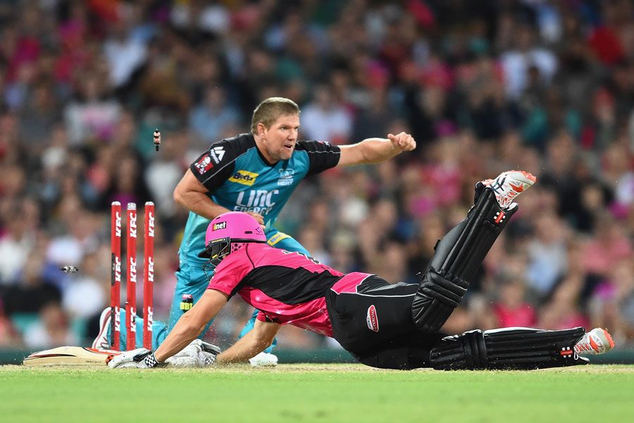 James Hopes removes the bails to dismiss Sean Abbott