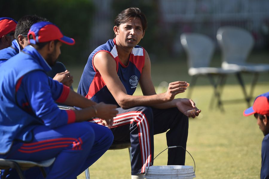 Mohammad Asif sits on the sidelines during a one-day match